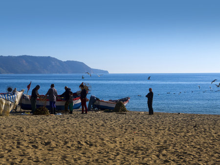 Fishermen sorting out their nets on the Burriana Beach in Nerja Spainのeditorial素材