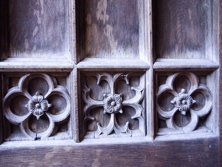 Ancient wooden carved door in York Englandの写真素材