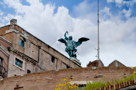 Statue of St Michael on top of the Castel Sant Angelo in Rome Italyのeditorial素材
