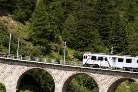 This little red train takes you on one of the 10 greatest train journeys in world. It runs from Tirana in Italy to St Moritz and onto Lake Luganoのeditorial素材