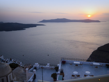Sunset over the Crater of the New Volcano in the Caldera Santorini Greeceのeditorial素材