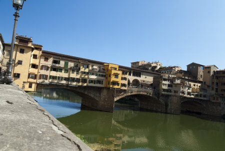 The Ponte Vecchio over the River Arno in Florence Tuscany Italyのeditorial素材