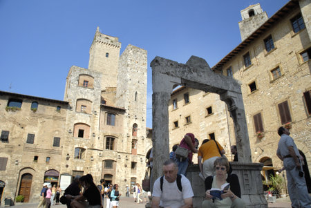 The Medieval Towers and town well of San Gimignano Tuscany Italyのeditorial素材