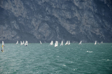 Windsurfers on Lake Garda at the Northern end where the wind is constant in Italyのeditorial素材