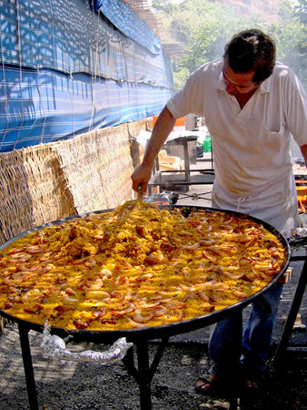 Cooking a gigantic paella on the beach at Nerja Andalucia Spainのeditorial素材