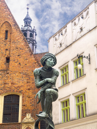Statue by The Church of Mariacki or St Marys Church in Krakow Polandのeditorial素材