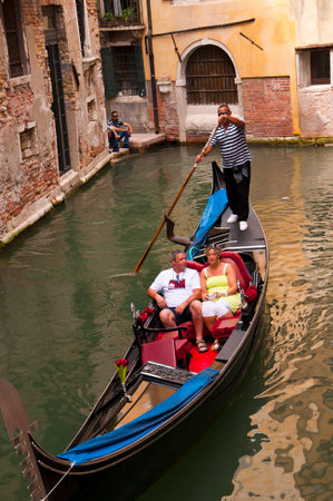 Narrow canal with Gondola in Venice Italyのeditorial素材