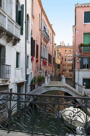 Narrow canal with Gondola in Venice Italyの写真素材