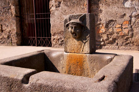 Street fountain in the once buried city of Pompeii Italyの写真素材