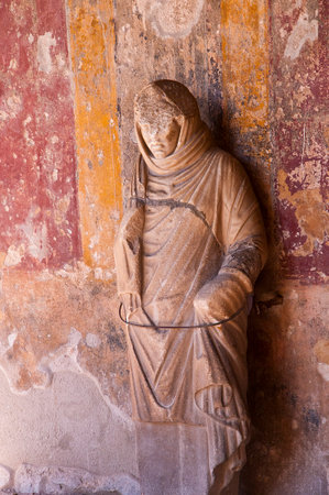 Statue in the ruined city of Pompeii Italyのeditorial素材