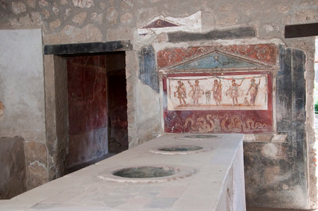 Shop counter in the once buried city of Pompeii Italyのeditorial素材