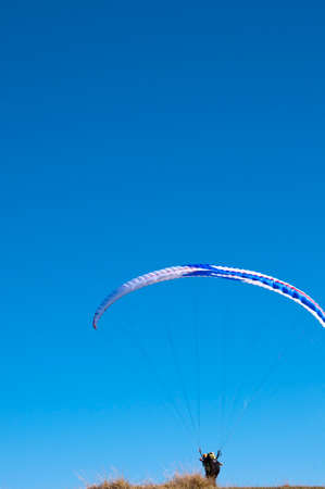 Paraglider at the top of Monte Baldo above Malcesine Italyの写真素材