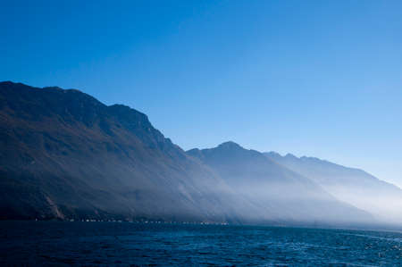 View down the lake from Riva del Garda on Lake Garda Italyの写真素材