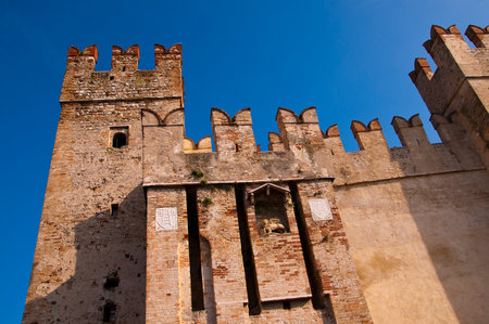 Sirmione is one of the lovely small towns on this lake in Northern Italy with a Scalieri Castle guarding the town  Lake Garda is a popular European tourist destination situated near the Dolomites and Italian Alps のeditorial素材