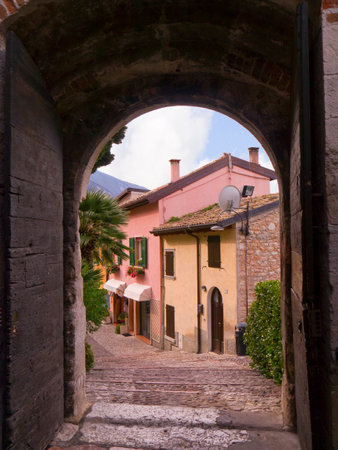 View through the castle gate in Malcesine on Lake Garda Italyのeditorial素材
