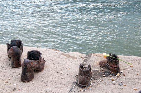 Bronze shoes on the quayside of the River Danube in Budapest to remember the deportation of Hungarian Jews to the Nazi Death Campsのeditorial素材