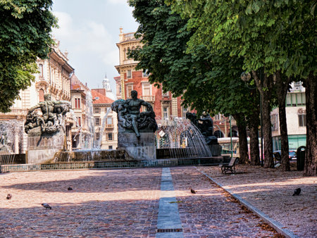 Flower filled Park on Piazza Solferino with Fountains and Statues in Turin Italyのeditorial素材