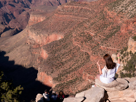 Sitting on the South Rim of the Grand Canyon in the USAのeditorial素材