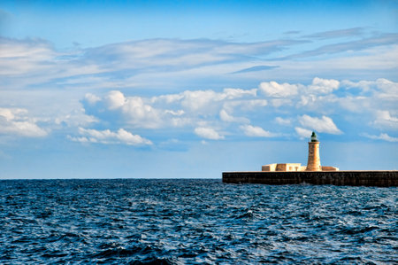 Lighthouse at the entrance to the Grand Harbour in Valleta Maltaのeditorial素材