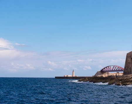 Lighthouse at the entrance to the Grand Harbour in Valleta Maltaの写真素材