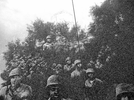 Marble wall etched with images from the Korean War in Washington USA