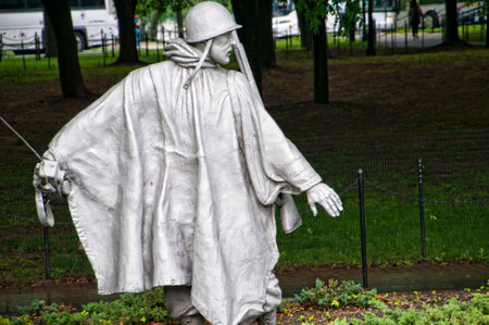 The Korean wall memorial depict 19 statues that depict soldiers on patrol. A granite wall has a mural of the faces of 2,400 unnamed soldiers with a reading that states Freedom is not free.のeditorial素材