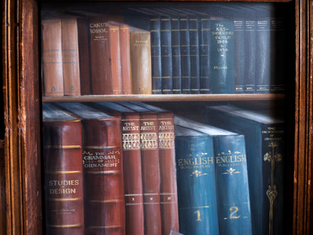 Painted wall of books in Bodelwyddan Castle in North Walesのeditorial素材