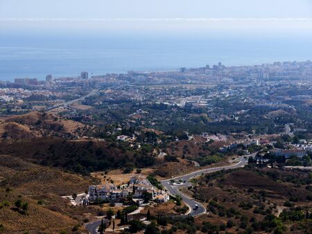 View of the coast from Mijas one of the most beautiful 'white' villages of Andalucia. It is in the Alpujarra mountains above the coastの写真素材