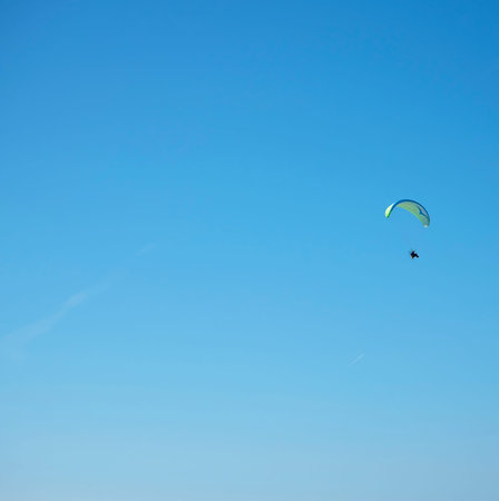 Paraglider from the Balcon de Europa is a viewpoint down the coast set in the cliffs in Nerja Spain