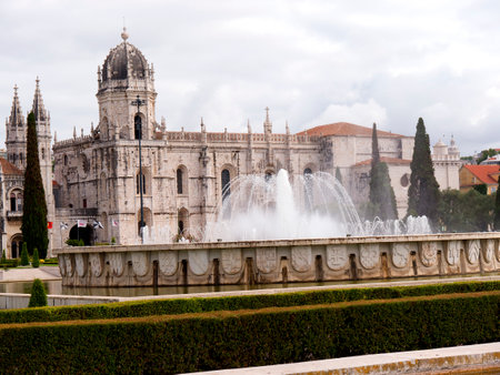 The Jeronimos Monastery  with the Praca do Imperio: gardens centred upon a large fountain, laid out during World War II in Lisbon Portugalのeditorial素材