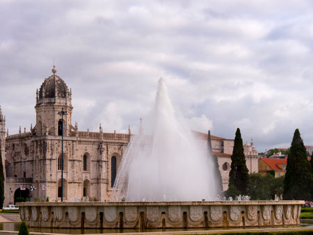 The Jeronimos Monastery  with the Praca do Imperio: gardens centred upon a large fountain, laid out during World War II in Lisbon Portugalのeditorial素材