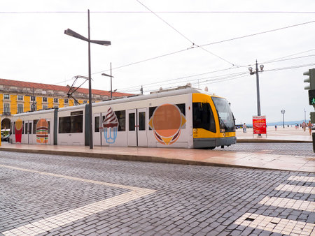 Tram in the "Praca do comercio", Commerce Square in Lisbon, Portugalのeditorial素材