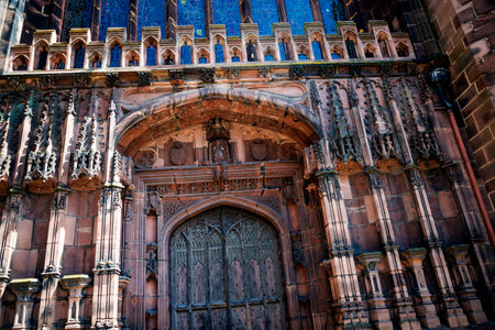 Facade and main door of Chester Cathedral which is a Church of England cathedral and the mother church of the Diocese of Chester.のeditorial素材