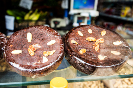 Madeira Honey and Almond Cake in City Market the Mercado dos Lavradores or the Market of the Workersのeditorial素材