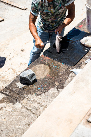 Gutting the catch in Camara de Lobos is a fishing village near the city of Funchal Madeira