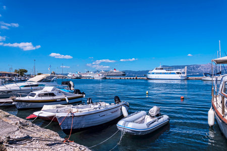 The main port on the island of Corfu is a deep harbour that can accommodate large Cruise Liners as well as  fishing boats and pleasure craft. The harbour is ringed by tavernas and cafes and it is overlooked by the massive fortifications of the New Fortresのeditorial素材