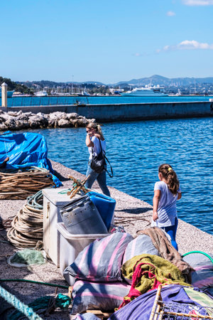The main port on the island of Corfu is a deep harbour that can accommodate large Cruise Liners as well as  fishing boats and pleasure craft. The harbour is ringed by tavernas and cafes and it is overlooked by the massive fortifications of the New Fortresのeditorial素材