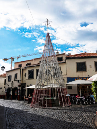 Main Street in Camara de Lobos a fishing village near the city of Funchal Madeira has some of the highest cliffs in the worldのeditorial素材