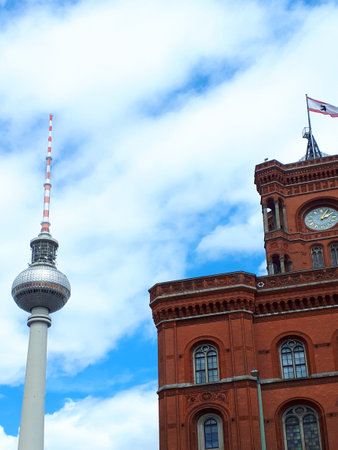 Berlin Germany The Red Brick Town Hall and the television tower or Fernsehturm. It is possible to go up to the viewing platform for vistas over the cityのeditorial素材