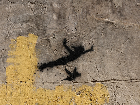 Graffitti of Peter Pan in the Kazimierz District, the Jewish area of the city in Poland.Kazimierz has rebounded and is today KrakÃ³wâs most exciting district.Now a bustling, bohemian districtのeditorial素材