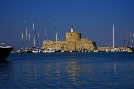 Fort St Nikolas guarding Mandraki Harbour on the island of Rhodesのeditorial素材
