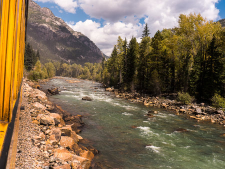 The River Animas as it flows by the Railroad from Durango to Silverton in Colorado USAの写真素材