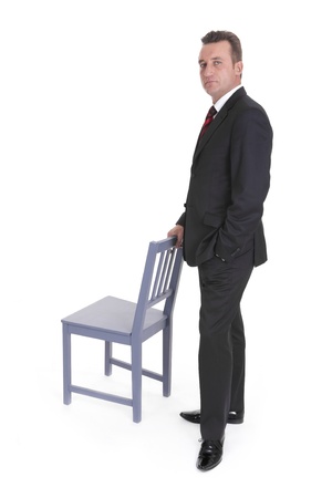 man leaning on an empty chair onn white background の写真素材
