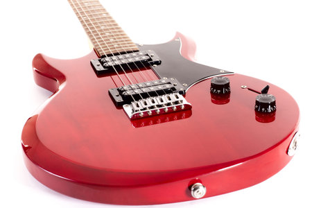 red guitar closeup isolated on white backgroundの写真素材