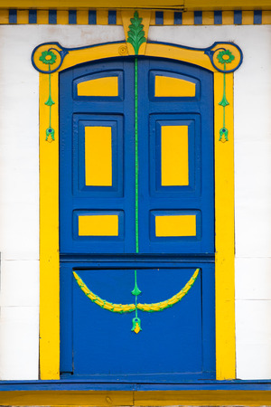 artisan colourful colonial style door in Salento, Colombiaの写真素材