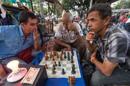 October 21, 2016 Medellin, Colombia: men playing chess outdoors in the flea marketのeditorial素材