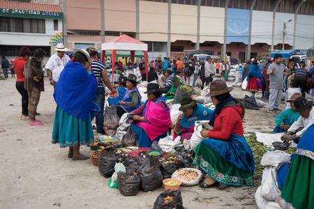 July 22, 2016 Alausi,Ecuador: indigenous women in the produce marketのeditorial素材