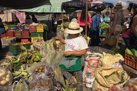 July 15, 2017 Villa de Leyva, Colombia: vendor selling produce in the local farmer's marketのeditorial素材