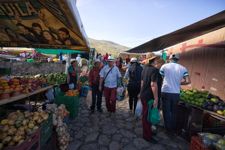 July 15, 2017 Villa de Leyva, Colombia: people walk through the main plaza at the annual fiesta of the colonial town filed with food standsのeditorial素材
