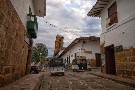 July 21, 2017 Barichara, Colombia: small three wheeled taxis driving through the cobblestone streets of the tourist townのeditorial素材